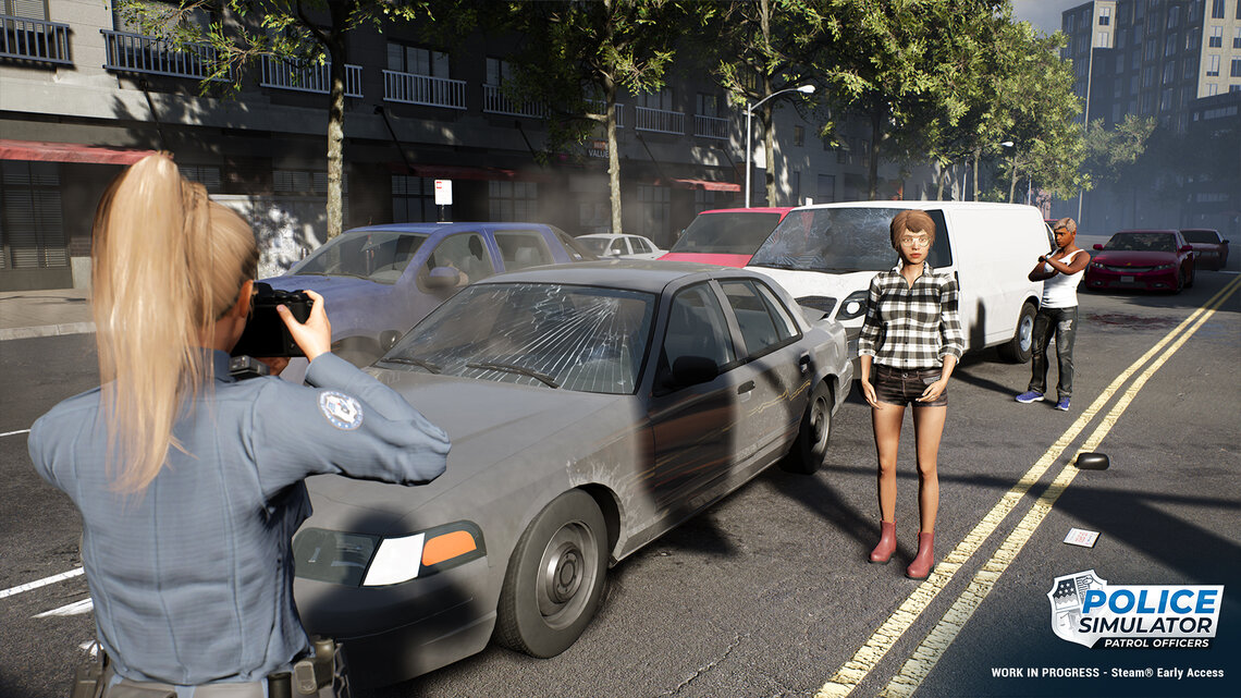 [Translate to German:] A policewoman records an accident by taking photos at the accident site. 